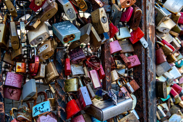 Colorful Love Padlocks Attached On Iron Fence