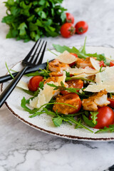 salad with arugula, shrimps and parmesan cheese