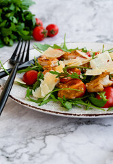 salad with arugula, shrimps and parmesan cheese