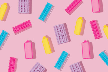 Hair rollers or curlers creative pattern on pastel pink background. Colorful layout. Fun idea for...