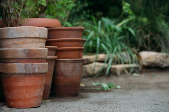 Stack Of Flower Pots In Yard