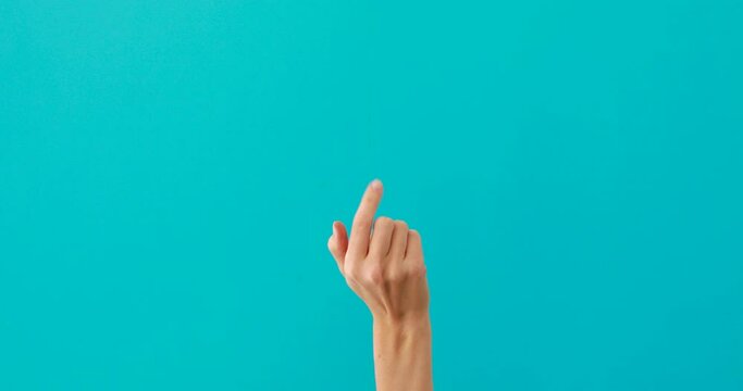 Woman does inviting gestures by elegant finger on turquoise
