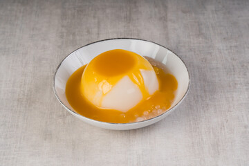 tofu pudding or taho with manga syrup and tapioca pearl