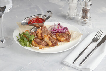 Grilled meat on a plate, serving in a restaurant