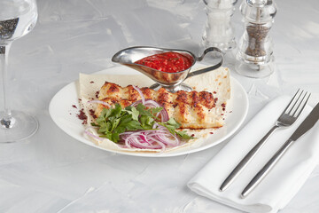 Grilled meat on a plate, serving in a restaurant