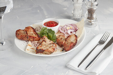 Grilled meat on a plate, serving in a restaurant