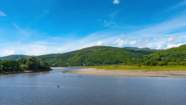 View downstream from Penmaenpool Toll Bridge, near Dolgellau in Merionethshire County, Wales, UK