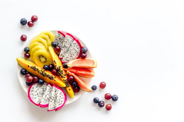 Mixed tropical exotic fruit in white dish