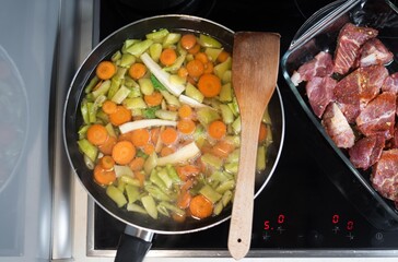 Top view of vegetables cooking in pan