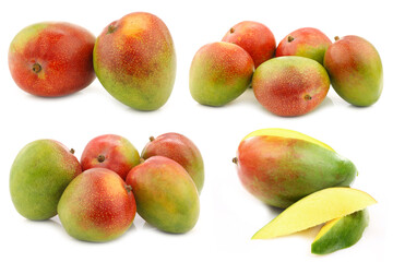 fresh colorful mango fruits and a cut one on a white background