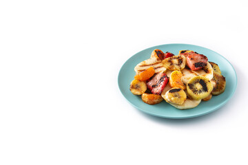 GRILLED FRUIT on a blue plate isolated on white background.Copy space
