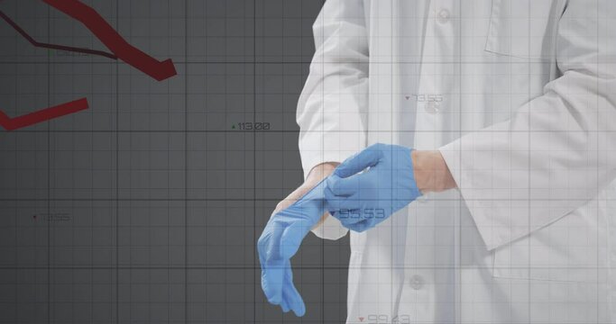 Financial data processing against mid section of doctor wearing surgical gloves