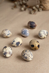 Obraz premium Easter composition, quail eggs on a brown background. Side view.