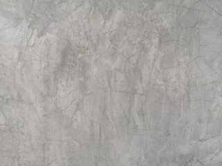 crack on cement wall bare polished grey color and smooth surface texture concrete material vintage background detail architect construction brick walls plastered and painted