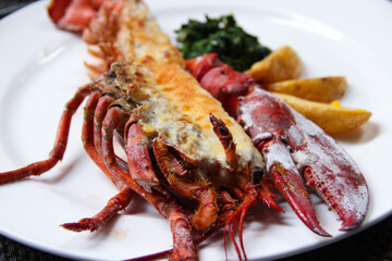 Lobster Thermidor, grilled lobster stuffed with cream and cheese, served with fried potato