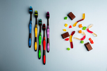 Set of colorful tooth brush on a blue background .
