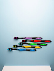 Set of colorful tooth brush on a blue background .