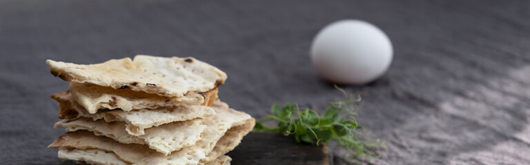 Homemade matzo with microgreen peas. Unleavened flatbread bread. Pesah celebration concept. Jewish Passover background. Pita.