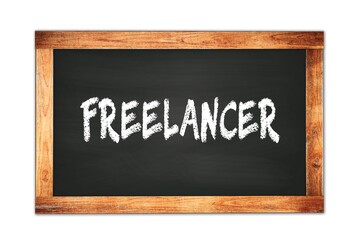 Fototapeta premium FREELANCER text written on wooden frame school blackboard.