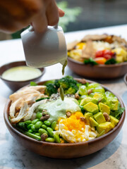 Cafe - Salad bowl with variety of vegetable, beans, salad cream