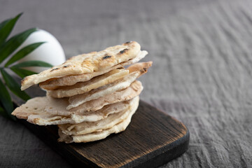 Homemade matzo with microgreen peas. Unleavened flatbread bread. Pesah celebration concept. Jewish Passover background. Pita.