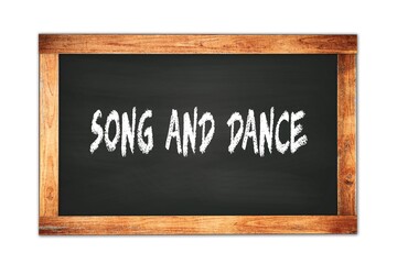 SONG  AND  DANCE text written on wooden frame school blackboard.