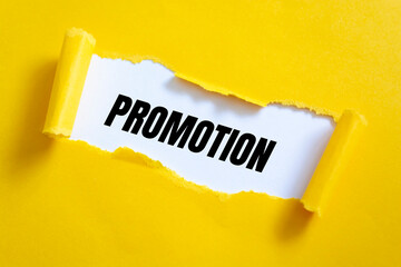 Promotion word written under white torn paper