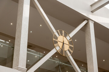 Modern clock on the second floor on the wall