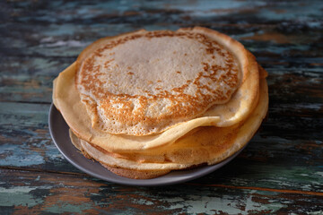 delicious fried pancakes on a wooden table. Rustic. Maslenitsa Festival