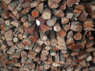 many piles of wood is piled up in the  yard to make fire design for simple and traditional lifestyle