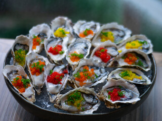 Fototapeta na wymiar International Buffet - Raw oyster with tobiko