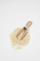 a handful of rice on a white background. healthy food. vegetarianism 