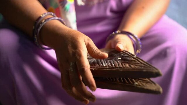 Woman making thekua for chhath puja