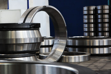 A large number of ready-made bearings in factory. Bearings of different sizes.Finished products of the bearing plant. Heavy industry concept. Metal products.