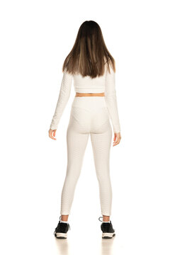 Rear View Of Young Teen Girl With White Blouse And Leggings