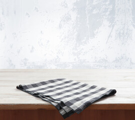 Napkin. Kitchen towel or table cloth on white wooden scene.  Mock up for design. Top view.