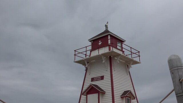 Lighthouse. Old red lighthouse. Blue sea background. Navigation equipment on the ocean.