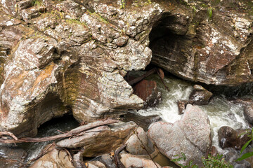 The São Miguel River at Riazama Waterfall near Sao Jorge, Goias, Brazil, situated in a canyon with lots of big rocks