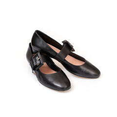 Black leather beautiful low-heeled black shoes isolated on white background