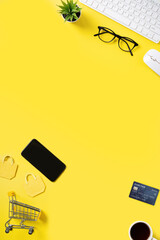 Top view of online shopping concept with credit card, smart phone and computer.