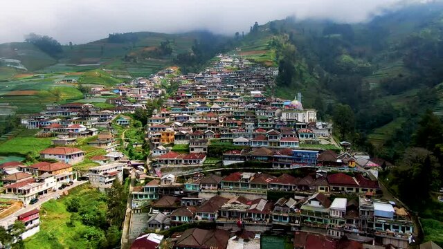 Remote village terraced high on Mount Sumbing slopes, Java, Indonesia aerial
