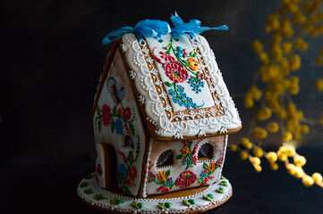 Gingerbread painted summer house on a dark background.