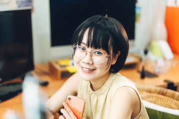  Portrait happy smile young adult asian business woman work from home.