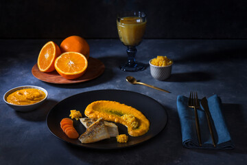 Baked fillet of zander, carrot-ginger puree and orange caviar.