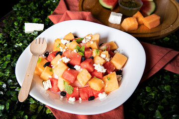Healthy Fruits and vegetable salad photoshoots on dark background.