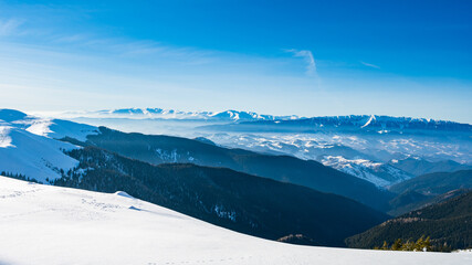 Panoramic view of Piatra Craiului mountain range in Romania during winter