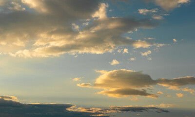 Naklejka na ściany i meble Sunset sky with dramatic clouds. Natural background.