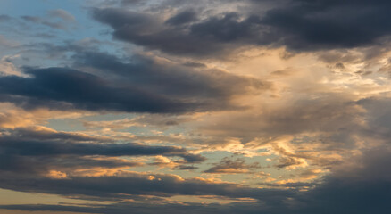 Sunset sky with dramatic clouds. Natural background.