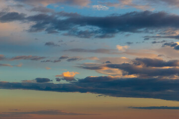 Sunset sky with dramatic clouds. Natural background.