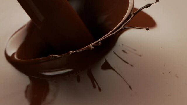 Super slow motion of splashing hot chocolate with crown shape. Filmed with high speed cinema camera, 1000fps.